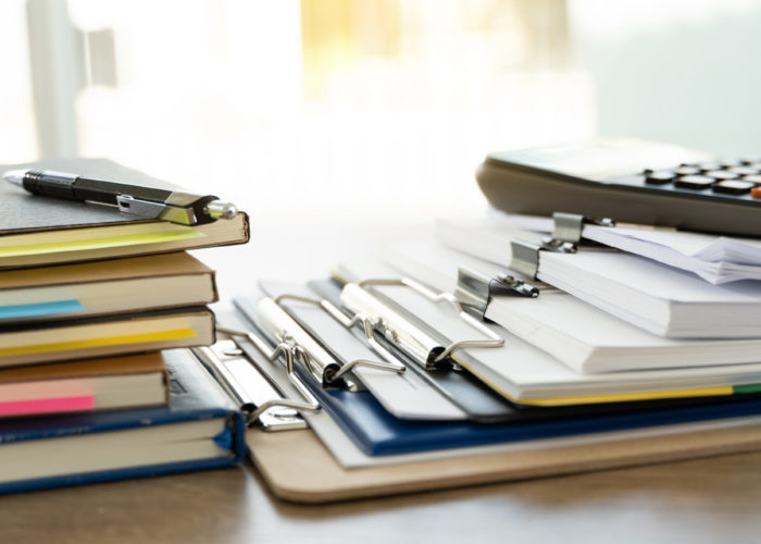 man report stack paper folder close up stacking of office working document with paper legal paperwork on top